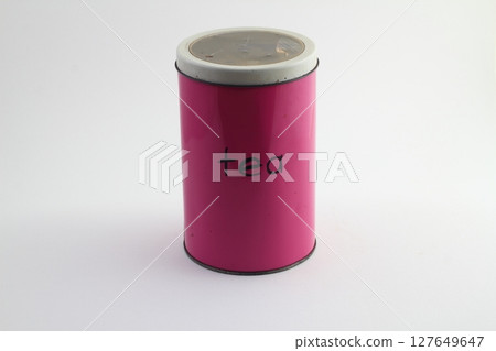 Colorful pink tin storage container on floral pattern 127649647