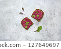 Beetroot Spread Generously Served on Grain Toast with Fresh Herbs 127649697