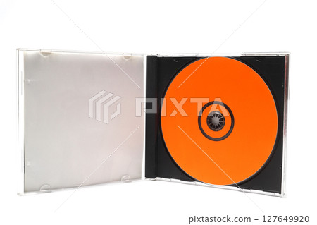 Close-Up Of Compact Discs Over White Background Close-Up Of Compact Discs Over White Background 127649920