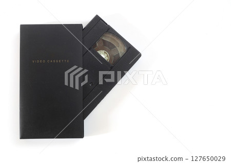 Black VHS video tape cassette with blank label isolated on white background 127650029