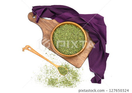 Dry mint in wooden bowl isolated on white background 127650324