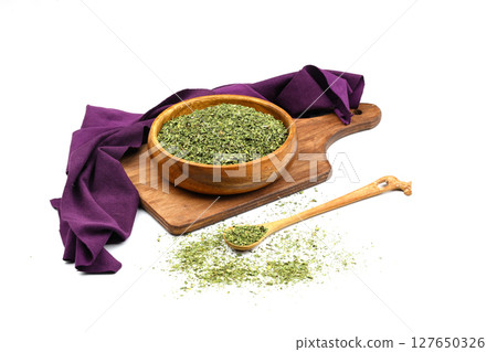 Dry mint in wooden bowl isolated on white background 127650326