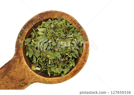 Dry mint in wooden bowl isolated on white background 127650336