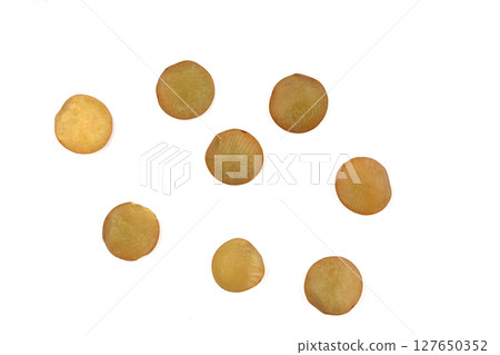 Heap of green lentils isolated on white background. Dry green lentils (Lens culinaris) close up. Top view. Heap of green lentils isolated on white background. Dry green lentils (Lens culinaris) close up. Top view. 127650352