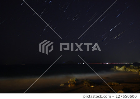 A view of the stars of the Milky Way with a mountain top in the foreground.Perseid Meteor Shower observation 127650600