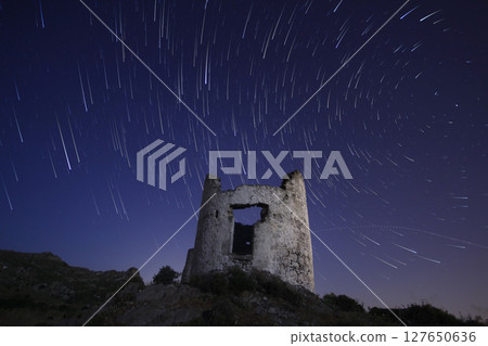 A view of the stars of the Milky Way with a mountain top in the foreground.Perseid Meteor Shower observation A view of the stars of the Milky Way with a mountain top in the foreground.Perseid Meteor Shower observation 127650636