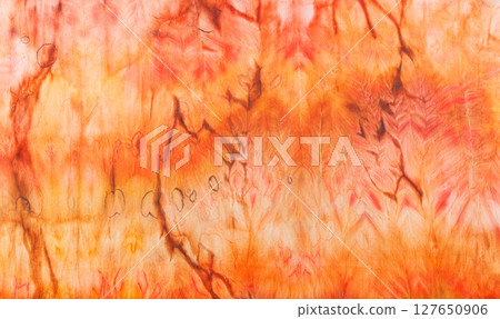 abstract pattern on silk fabric texture in yellow and brown tones abstract pattern on silk fabric texture in yellow and brown tones 127650906