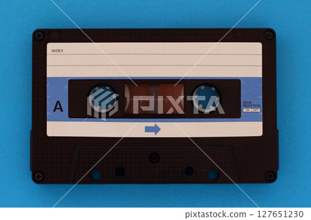 Vintage Cassette tape on a blue background with copy space Vintage Cassette tape on a blue background with copy space 127651230