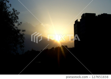 sunset in the city over buildings sunset in the city over buildings 127651838