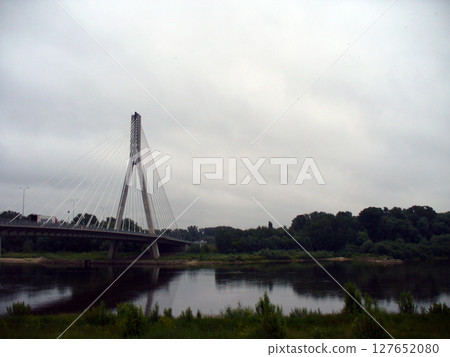 white bridge with pylons over the river white bridge with pylons over the river 127652080