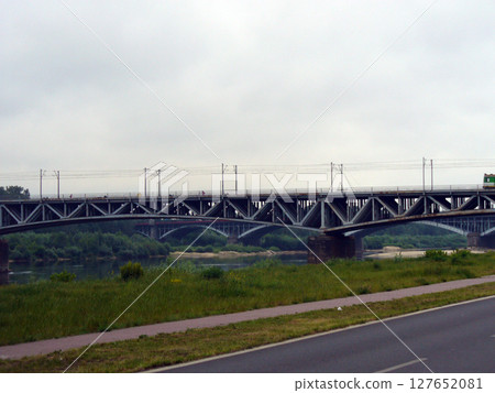 metal steel bridge over the river 127652081