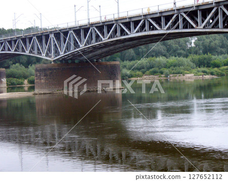 metal steel bridge over the river 127652112