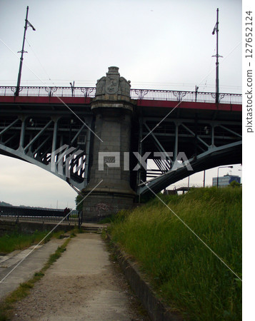metal iron bridge construction over the river metal iron bridge construction over the river 127652124