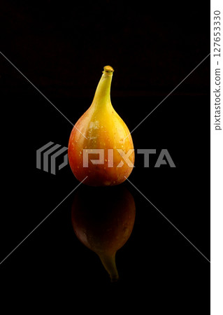 Fresh figs isolated on black background Fresh figs isolated on black background 127653330