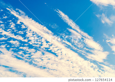 Scale clouds flowing in the blue sky b-3 Warm colors added 127654114