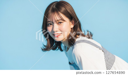 A portrait of a young Japanese woman with a refreshing and natural smile A portrait of a young Japanese woman with a refreshing and natural smile 127654890