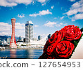 A red rose that shines in the blue sky 127654953