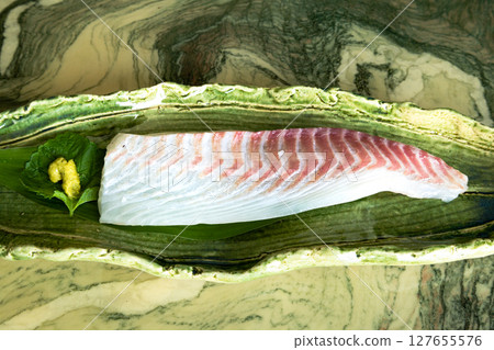 Sea bream steak on a plate Sea bream steak on a plate 127655576
