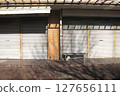 Closed store, scene with closed shutters 127656111