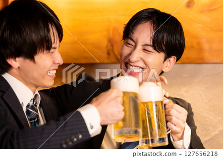 Drinking party: Young people toasting at an izakaya Drinking party: Young people toasting at an izakaya 127656218