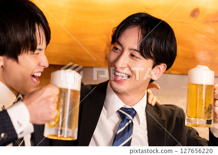 Drinking party: Young people toasting at an izakaya Drinking party: Young people toasting at an izakaya 127656220