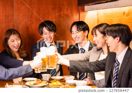 Drinking party: Young people toasting at an izakaya 127656447