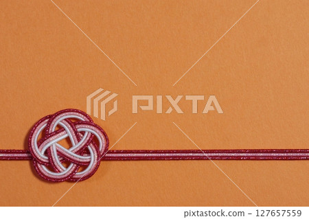 Japanese-style flower-shaped material Orange background 127657559