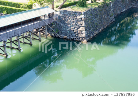 Sayabashi Bridge over the moat at Tamamo Park, historic site of Takamatsu Castle, Kagawa Prefecture Sayabashi Bridge over the moat at Tamamo Park, historic site of Takamatsu Castle, Kagawa Prefecture 127657986