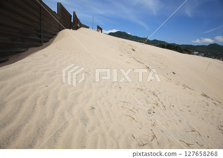 Traces of wind ripples on the sandy beach Traces of wind ripples on the sandy beach 127658268