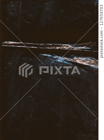 Crushed foil. Weathered steel effect. Silver rust wrinkled aged distressed metallic film dust overlay scratched texture on abstract dark black background. Crushed foil. Weathered steel effect. Silver rust wrinkled aged distressed metallic film dust overlay scratched texture on abstract dark black background. 127658703