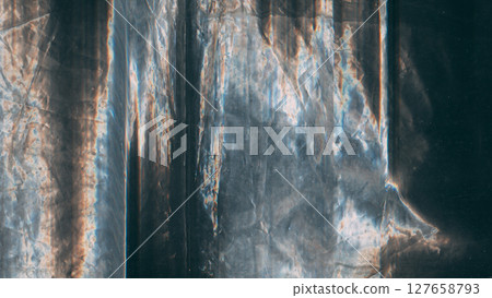 Aged foil. Distressed texture. Blue orange white color curve line dust scratches uneven static artifacts art abstract black background. Aged foil. Distressed texture. Blue orange white color curve line dust scratches uneven static artifacts art abstract black background. 127658793