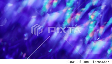 Glow flare. Defocused abstraction. Blurred colorful gleam lens on bokeh light reflection purple blue art glint background. Glow flare. Defocused abstraction. Blurred colorful gleam lens on bokeh light reflection purple blue art glint background. 127658863