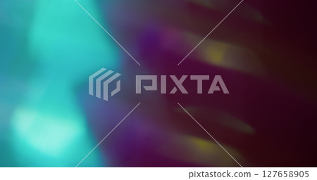 Blur bokeh effect. Multicolored glare. Blue purple texture gleaming lens flare on blurred light modern dark black background. Blur bokeh effect. Multicolored glare. Blue purple texture gleaming lens flare on blurred light modern dark black background. 127658905