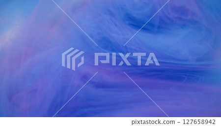 Ethereal vapor. Flow art. Defocused blue pink color mix liquid ink texture in water fluid spreading on abstract creative background. Ethereal vapor. Flow art. Defocused blue pink color mix liquid ink texture in water fluid spreading on abstract creative background. 127658942