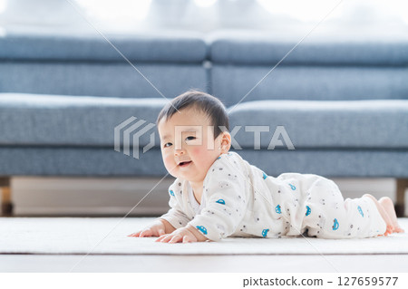 A crawling baby. 127659577