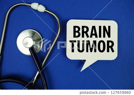 Brain Tumor text message on speech bubble with stethoscope on blue background Brain Tumor text message on speech bubble with stethoscope on blue background 127659860