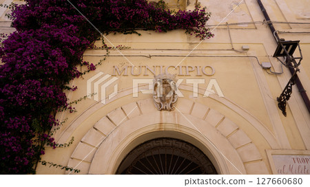 Bougainvillea cascading over the entrance of Tropea Municipio in Calabria, Italy 127660680