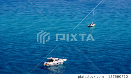 Sailboat and Motorboat navigating near Tropea, Calabria, Italy 127660710