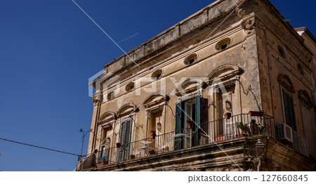 Old Building with Balcony and Green Shutters in Tropea, Italy 127660845