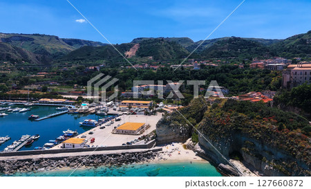 Tropea, Italy, aerial view of the harbor, beach and mountain landscape surrounding the city Tropea, Italy, aerial view of the harbor, beach and mountain landscape surrounding the city 127660872