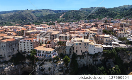 Tropea, Italy, aerial view of colorful houses standing on a cliff overlooking the Tyrrhenian Sea Tropea, Italy, aerial view of colorful houses standing on a cliff overlooking the Tyrrhenian Sea 127660904