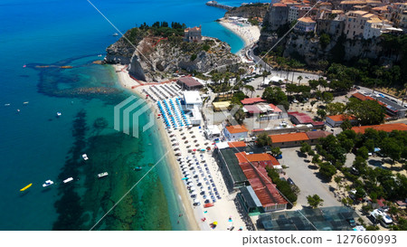 Aerial view of Tropea, Calabria, showing the beach, Isola Bella and the Tyrrhenian Sea Aerial view of Tropea, Calabria, showing the beach, Isola Bella and the Tyrrhenian Sea 127660993