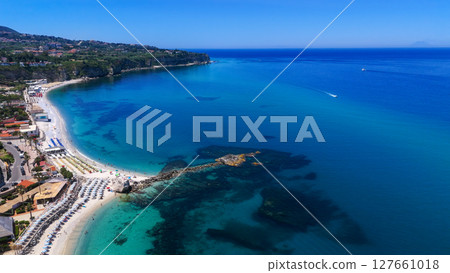 Aerial view of Tropea beach and coastline in Calabria, Italy, showing turquoise waters and white 127661018