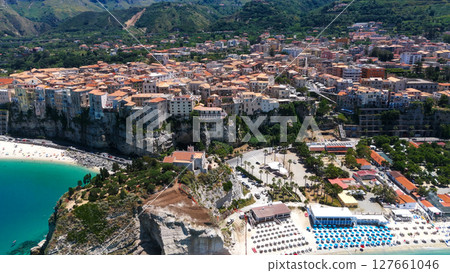 Tropea, Italy, aerial view of colorful houses perched on cliffs overlooking turquoise Tyrrhenian Sea 127661046