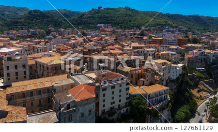 Tropea cityscape featuring traditional architecture and overlooking scenic hills in Calabria, Italy Tropea cityscape featuring traditional architecture and overlooking scenic hills in Calabria, Italy 127661129