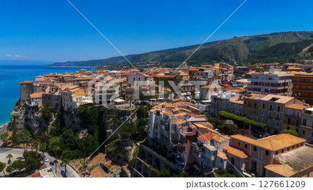 Tropea, Italy, aerial view of colorful houses on cliff overlooking Tyrrhenian Sea Tropea, Italy, aerial view of colorful houses on cliff overlooking Tyrrhenian Sea 127661209