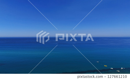 Aerial view of Tropea, Calabria, showing calm Tyrrhenian Sea and blue sky 127661210