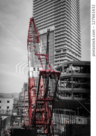 Red crane and building 127661632
