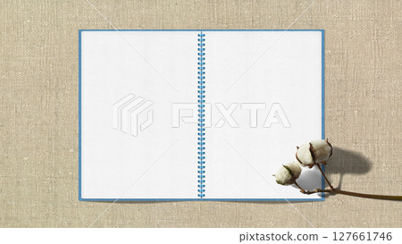 Fluffy cotton flowers and a sketchbook with the background of "Garabo" cotton fabric Fluffy cotton flowers and a sketchbook with the background of "Garabo" cotton fabric 127661746