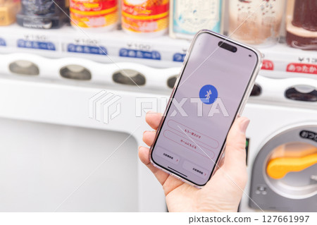 Hand making electronic payment for vending machine 127661997